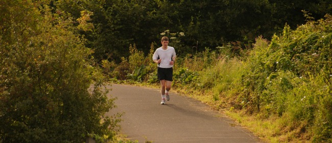 man running on a country trail